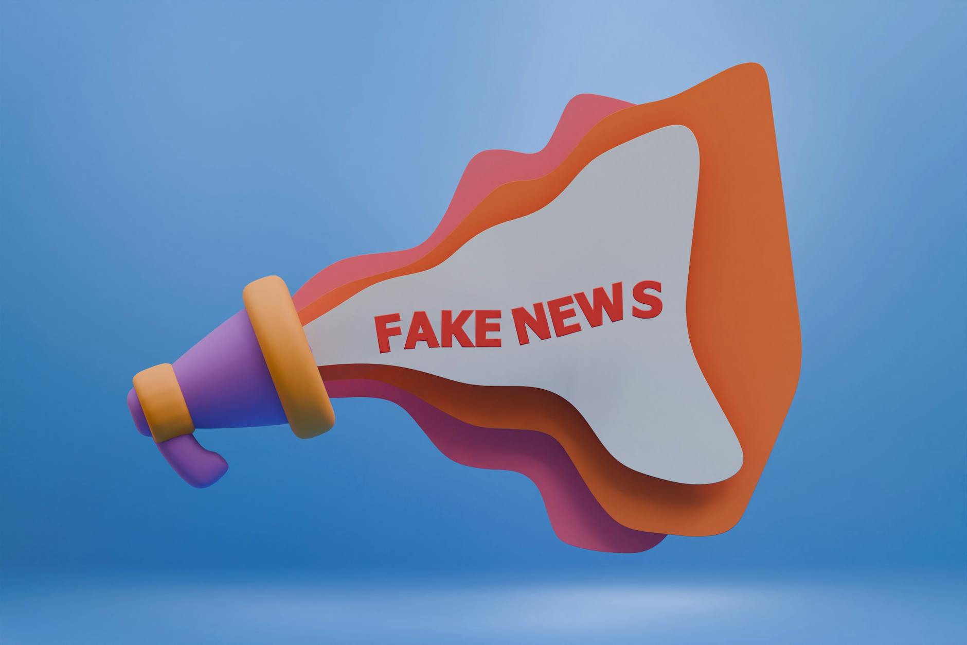 Kolorowy megafon 3D z napisem Fake News symbolizujący dezinformację